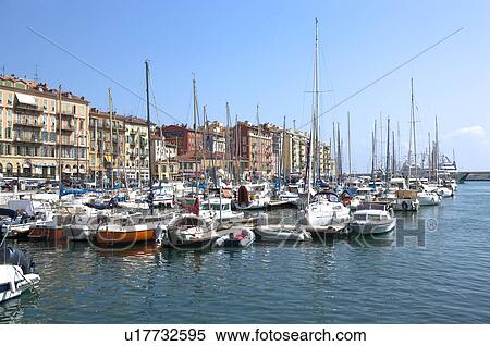 Stock Photography - Fishing boats docked at a harbor, Nice, French Riviera, France, Europe. Fotosearch