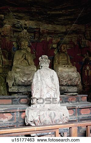 Stock Image - Stone Carving of Buddha Preaching, The Dazu Rock Carvings, Chongqing, China. Fotosearch