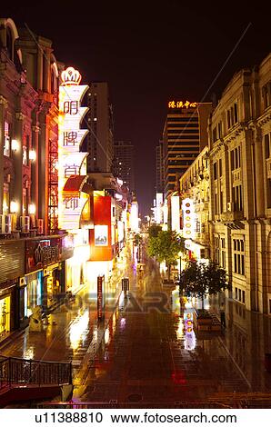 Stock Image - China, Hubei Province, Wuhan, Hankou, Hanjiang Road, Pedestrian Street, Nightlife. Fotosearch