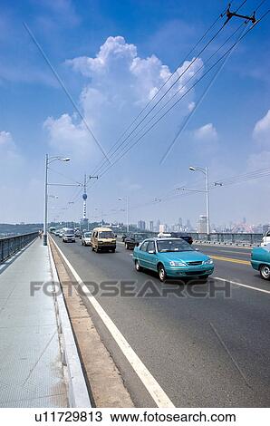 Stock Image - China, Hubei Province, Wuhan, Wuhan Yangtze River Bridge. Fotosearch