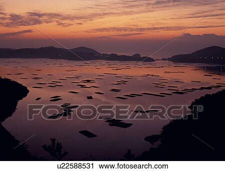 Stock Image - Morning Glow at Mushiake Bay, Setouchi, Okayama, Japan. Fotosearch