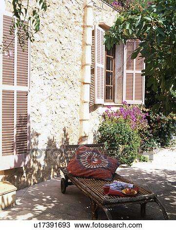 Stock Image - Deckchair in the shade. Fotosearch