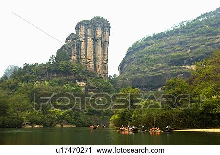 Stock Image - Asia, China, Fujian, UNESCO, World Cultural Heritage, World Natural Heritage, Wuyi Mountain, Nine-twist Stream Scenic Area, Jade Girl Peak, Nine-twist Stream, Floating On Water. Fotosearch
