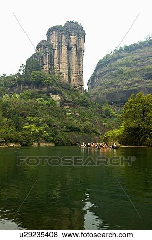 Stock Photo - Asia, China, Fujian, UNESCO, World Cultural Heritage, World Natural Heritage, Wuyi Mountain, Nine-twist Stream Scenic Area, Jade Girl Peak, Nine-twist Stream, Floating On Water. Fotosearch