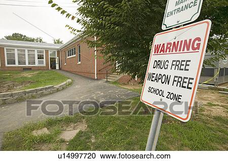 A grade school displays sign stating it's a "Drug Free and Weapon Free" school zone, Clark School, Webster Groves, Missouri  View Large Photo Image Stock Image - A grade school displays sign stating it's a "Drug Free and Weapon Free" school zone, Clark School, Webster Groves, Missouri . Fotosearch