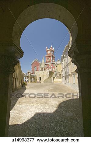 A keyhole view through arch of Da Pena Royal Palace, Palácio da Pena, or "Castelo da Pena" as it is more commonly known, the most complete and notable example of Portuguese architecture from the Romantic period, 1839, Portugal, Sintra View Large Photo Image Stock Photo - A keyhole view through arch of Da Pena Royal Palace, Palácio da Pena, or "Castelo da Pena" as it is more commonly known, the most complete and notable example of Portuguese architecture from the Romantic period, 1839, Portugal, Sintra . Fotosearch