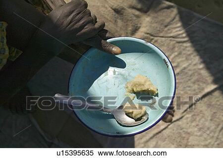 A plate of food is the total food offered to some in Kenya at the Pepo La Tumaini Jangwani, HIV/AIDS Community Rehabilitation Program, Orphanage & Clinic. Pepo La Tumaini Jangwani (wind of hope in the arid place) offers hope, support and care for orphan View Large Photo Image Stock Photography - A plate of food is the total food offered to some in Kenya at the Pepo La Tumaini Jangwani, HIV/AIDS Community Rehabilitation Program, Orphanage & Clinic. Pepo La Tumaini Jangwani (wind of hope in the arid place) offers hope, support and care for orphan . Fotosearch