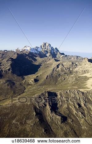 Stock Photo - Aerial of Mount Kenya, Africa and snow in January, the second highest mountain at 17, 058 feet or 5199 Meters. Fotosearch