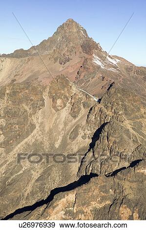 Stock Photo - Aerial of Mount Kenya, Africa and snow in January, the second highest mountain at 17, 058 feet or 5199 Meters. Fotosearch