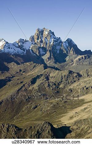 Stock Photo - Aerial of Mount Kenya, Africa and snow in January, the second highest mountain at 17, 058 feet or 5199 Meters. Fotosearch