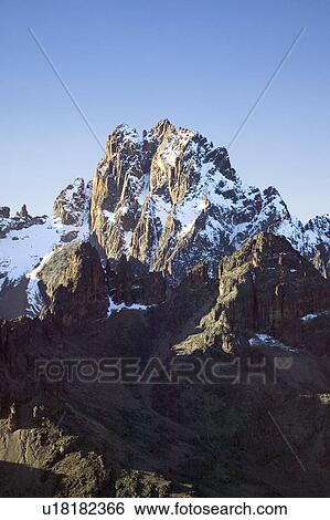 Stock Photograph - Aerial of Mount Kenya, Africa and snow in January, the second highest mountain at 17, 058 feet or 5199 Meters. Fotosearch