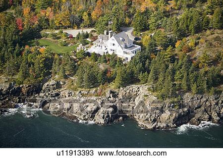 Stock Image - Aerial view of ocean-front home at Acadia National Park, Maine. Fotosearch