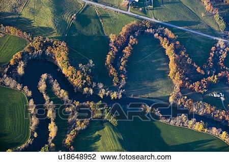 Stock Image - Aerial view of river and autumn trees near Augusta, Maine. Fotosearch