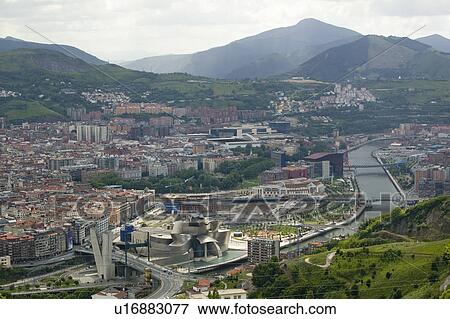 Aerial view of the Guggenheim Museum of Contemporary Art of Bilbao (Bilbo) located on the North Coast of Spain in the Basque region. Nicknamed "The Hole", this is a contemporary museum built of titanium, limestone and glass and was designed by Canadian ci View Large Photo Image Stock Photo - Aerial view of the Guggenheim Museum of Contemporary Art of Bilbao (Bilbo) located on the North Coast of Spain in the Basque region. Nicknamed "The Hole", this is a contemporary museum built of titanium, limestone and glass and was designed by Canadian ci. Fotosearch