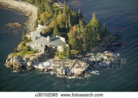 Stock Photography - Aerial views of luxury home in Acadia National Park, Maine in autumn. Fotosearch