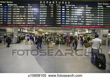 Amtrak train travelers stand in line under Departures sign at Penn Station, New York City, Manhattan, New York View Large Photo Image Stock Photography - Amtrak train travelers stand in line under Departures sign at Penn Station, New York City, Manhattan, New York. Fotosearch