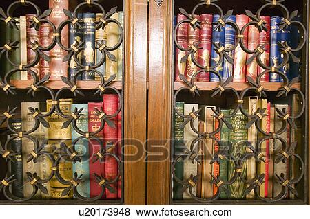 Stock Photo - Antique books in Gothic library shelves at Hearst Castle, San Simeon, Central California Coast. Fotosearch