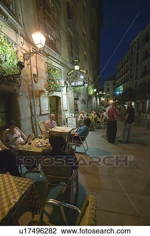 Café scene at twilight near Royal Palace, Madrid, Spain View Large Photo Image Stock Image - Café scene at twilight near Royal Palace, Madrid, Spain. Fotosearch