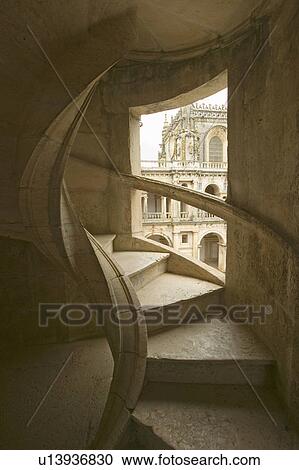 Stock Image - Circular stairway of the Convent of the Knights of Christ and Templar Castle, founded by Gualdim Pais in 1160 AD, is a Unesco World Heritage Site in Tomar, Portugal. Fotosearch