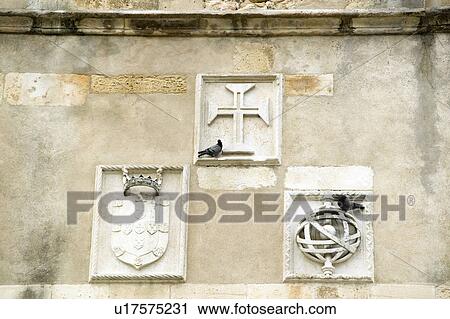Stock Image - Detail shot of facade of the Igreja da Santa Maria dos Olivais, considered as the mother church of the Order of the Knights Templar in Portugal and the resting place of many of the past Masters, Tomar, Portugal. Fotosearch