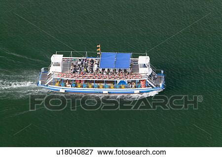 Elevated view of tourist boat in Estacio Maritima, harbor of Barcelona, Spain View Large Photo Image Stock Photo - Elevated view of tourist boat in Estacio Maritima, harbor of Barcelona, Spain. Fotosearch