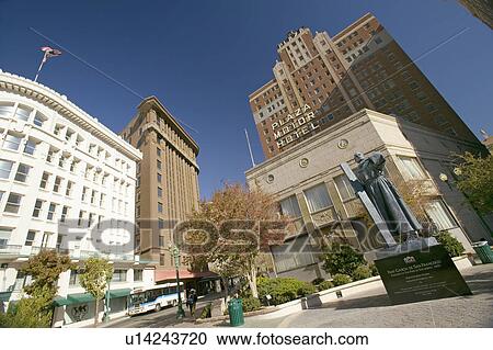 Stock Image - Garcia de San Francisco statue with cross in front of Plaza Motor Hotel in Plaza district of El Paso, Texas. Fotosearch