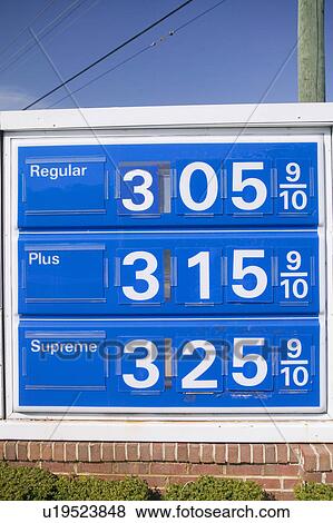 Stock Photo - Gas prices over $3. 00 per gallon at gas station depict energy crises in nation's capital, Washington D. C.. Fotosearch