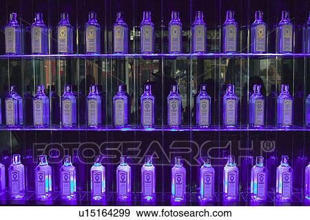 Multiple Gin bottles in purple light decorate shelves in bar in Barcelona, Spain View Large Photo Image Stock Photo - Multiple Gin bottles in purple light decorate shelves in bar in Barcelona, Spain. Fotosearch