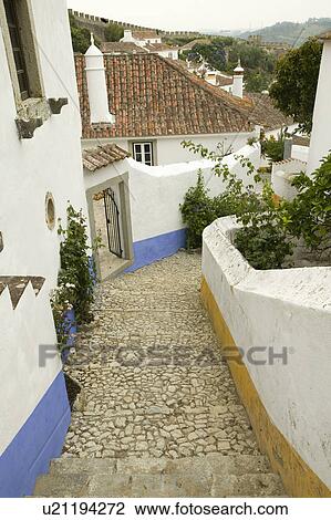 Narrow village streets of Obidos founded by the Celts in 300 BC, Portugal View Large Photo Image Stock Image - Narrow village streets of Obidos founded by the Celts in 300 BC, Portugal. Fotosearch
