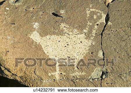 Native American petroglyphs featuring an image of a bird at Petroglyph National Monument, outside Albuquerque, New Mexico View Large Photo Image Stock Image - Native American petroglyphs featuring an image of a bird at Petroglyph National Monument, outside Albuquerque, New Mexico. Fotosearch