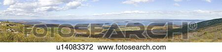 Stock Image - Panoramic autumn view from 1530 foot high Cadillac Mountain with views of the Porcupine Islands, Frenchman Bay and Holland America cruise ship in harbor, Acadia national Park, Maine. Fotosearch