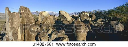 Stock Image - Panoramic image of petroglyphs at Three Rivers Petroglyph National Site, a (BLM) Bureau of Land Management Site, features more than 21, 000 Native American Indian petroglyphs and examples of prehistoric Jornada Mogollon rock art, off Route 54, South of Car. Fotosearch