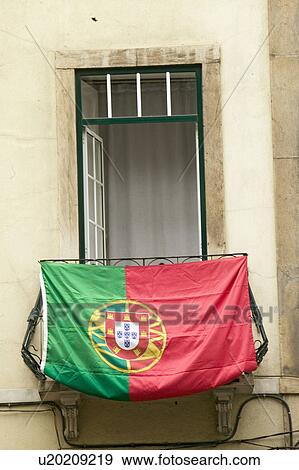 Stock Photo - Portuguese flag is displayed from apartment balcony in Lisboa, Lisbon, Portugal, in support of World Cup Soccer. Fotosearch