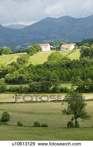 Sare, France in Basque Country on Spanish-French border, is a hilltop 17th century village surrounded by farm fields and mount Rhune in the Labourd province. Close to St. Jean de Luz, on the Cote Basque, France. View Large Photo Image Stock Photo - Sare, France in Basque Country on Spanish-French border, is a hilltop 17th century village surrounded by farm fields and mount Rhune in the Labourd province. Close to St. Jean de Luz, on the Cote Basque, France.. Fotosearch