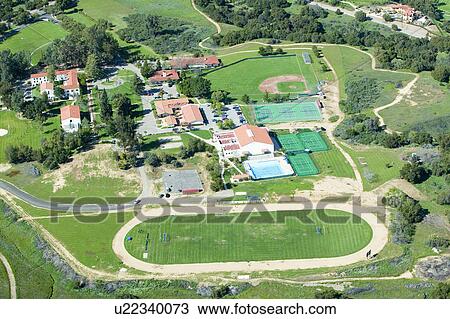 Stock Image - Springtime aerial view of Villanova Prep school with track, pool, baseball diamond, tennis courts and campus in view, Ojai, CA. Fotosearch