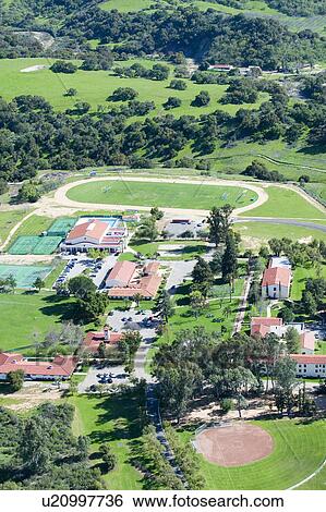 Stock Photograph - Springtime aerial view of Villanova Prep school with track, pool, baseball diamond, tennis courts and campus in view, Ojai, CA. Fotosearch