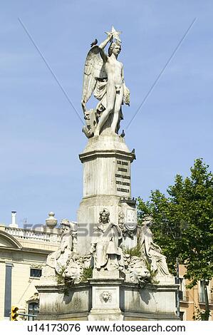 Stock Photograph - Statue in center of street in Barcelona, Spain. Fotosearch
