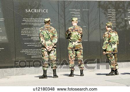 Three servicemen look at granite inscription on wall of Air Force Memorial, Arlington, Virginia in Washington D. C. area View Large Photo Image Stock Photo - Three servicemen look at granite inscription on wall of Air Force Memorial, Arlington, Virginia in Washington D. C. area. Fotosearch