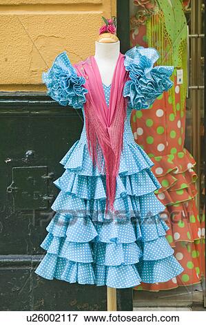 Stock Photo - Turquoise flamenco dress is displayed in Centro old district of Sevilla Spain. Fotosearch
