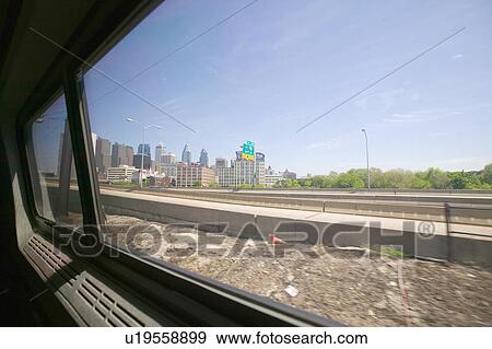 Stock Photo - View of Philadelphia skyline from moving Amtrak train, Philadelphia, Pennsylvania. Fotosearch