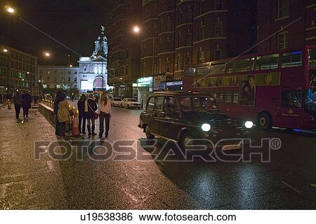 Wet night streets of West End of London's theater district with double decker bus and taxi driving by, England View Large Photo Image Stock Photograph - Wet night streets of West End of London's theater district with double decker bus and taxi driving by, England. Fotosearch