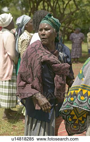 Stock Photography - A closeup of a member female from the "Women without Husbands" women who have been ostracized from society or who have lost their husbands and only have themselves as a group to look after each other in Meru, Kenya, Africa. Fotosearch