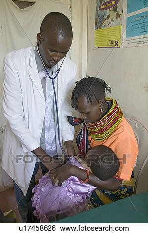 A doctor checks mother and children for HIV/AIDS at Pepo La Tumaini Jangwani, HIV/AIDS Community Rehabilitation Program, Orphanage & Clinic. Pepo La Tumaini Jangwani (wind of hope in the arid place) offers hope, support and care for orphan and vulnerable View Large Photo Image Stock Photograph - A doctor checks mother and children for HIV/AIDS at Pepo La Tumaini Jangwani, HIV/AIDS Community Rehabilitation Program, Orphanage & Clinic. Pepo La Tumaini Jangwani (wind of hope in the arid place) offers hope, support and care for orphan and vulnerable. Fotosearch