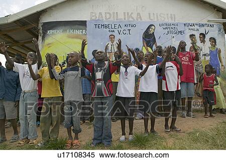 Stock Photography - A group of HIV/AIDS infected children sing song about AIDS at the Pepo La Tumaini Jangwani, HIV/AIDS Community Rehabilitation Program, Orphanage & Clinic. Pepo La Tumaini Jangwani (wind of hope in the arid place) offers hope, support and care for orphan . Fotosearch