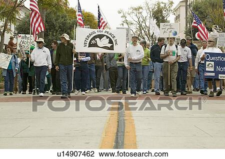 A large crowd of protesters are led by Veterans Against the Iraq War on State Street at an anti-Iraq War protest march in Santa Barbara, California on March 17, 2007 View Large Photo Image Stock Image - A large crowd of protesters are led by Veterans Against the Iraq War on State Street at an anti-Iraq War protest march in Santa Barbara, California on March 17, 2007. Fotosearch