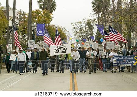 A large crowd of protesters are led by Veterans Against the Iraq War on State Street at an anti-Iraq War protest march in Santa Barbara, California on March 17, 2007 View Large Photo Image Stock Photo - A large crowd of protesters are led by Veterans Against the Iraq War on State Street at an anti-Iraq War protest march in Santa Barbara, California on March 17, 2007. Fotosearch