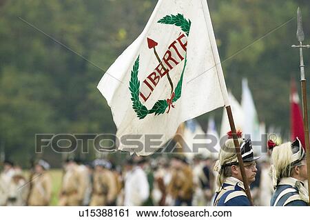 Stock Image - A "Liberty Flag" flies at the 225th Anniversary of the Victory at Yorktown, a reenactment of the siege of Yorktown, where General George Washington commanded 17, 600 American troops and French Comte de Rochambeau lead 5500 French troops, together defeating. Fotosearch