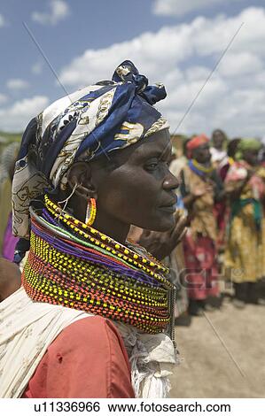 Stock Photograph - A profile of a Kenyan woman with beads at the Pepo La Tumaini Jangwani, HIV/AIDS Community Rehabilitation Program, Orphanage & Clinic. Pepo La Tumaini Jangwani (wind of hope in the arid place) offers hope, support and care for orphan and vulnerable child. Fotosearch