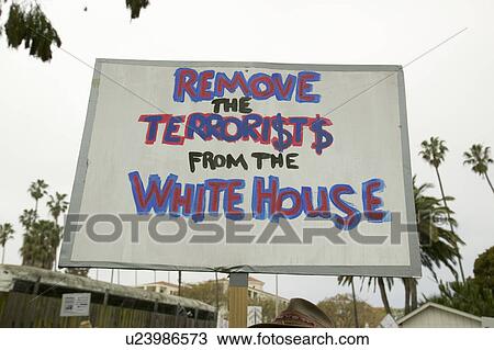 A sign says "Remove the terrorists from the White House" at an anti-Iraq War protest march in Santa Barbara, California on March 17, 2007 View Large Photo Image Stock Image - A sign says "Remove the terrorists from the White House" at an anti-Iraq War protest march in Santa Barbara, California on March 17, 2007. Fotosearch