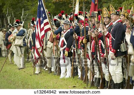 American Patriot soldiers line Surrender Road at the 225th Anniversary of the Victory at Yorktown, a reenactment of the siege of Yorktown, where General George Washington commanded 17, 600 American troops and French Comte de Rochambeau lead 5500 French tro View Large Photo Image Stock Image - American Patriot soldiers line Surrender Road at the 225th Anniversary of the Victory at Yorktown, a reenactment of the siege of Yorktown, where General George Washington commanded 17, 600 American troops and French Comte de Rochambeau lead 5500 French tro. Fotosearch